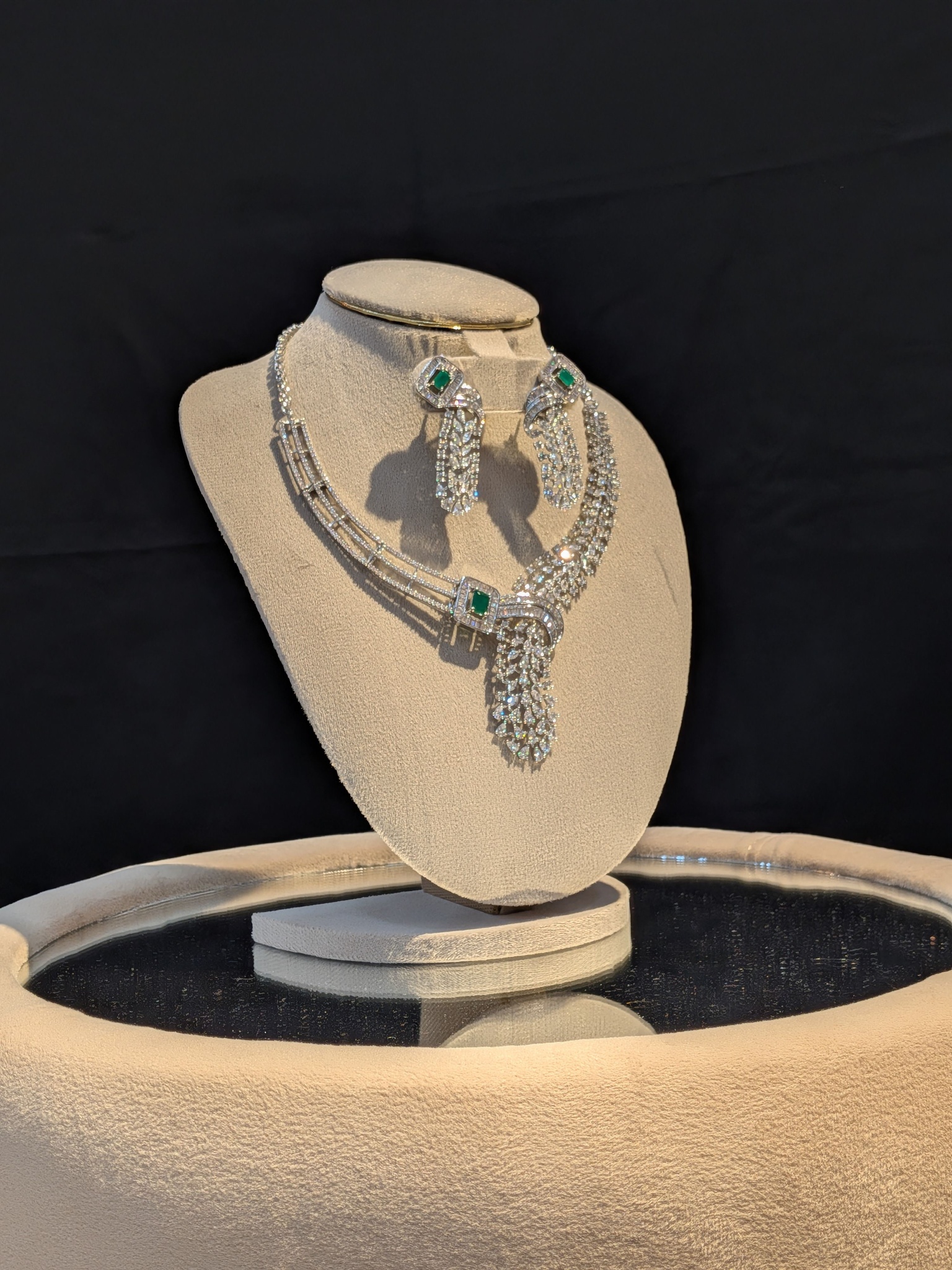 Diamond and emerald necklace with a teardrop pendant and matching earrings